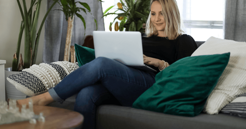 Mom Entrepreneur Working on her laptop on the couch. 