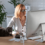Mom Working On Her Computer In Her Home Office.