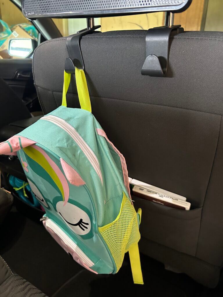 Headrest hooks for car seat. Keep bags off the floor while traveling with easy access for your kids to grab new toys and games when they need them. 